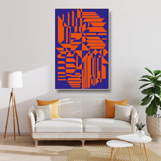 Modern living room with a geometric abstract painting, white sofa, and decorative items.