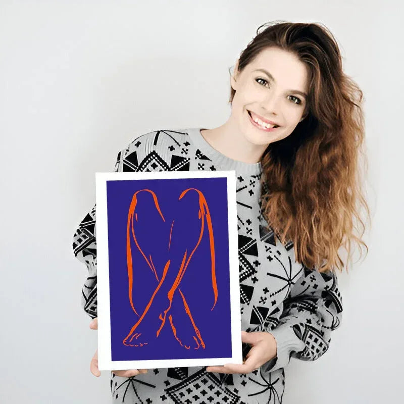 Woman holding a framed artwork with red abstract design on a blue background
