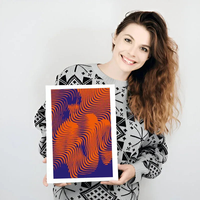 Woman holding a framed abstract artwork with wavy orange and purple design.