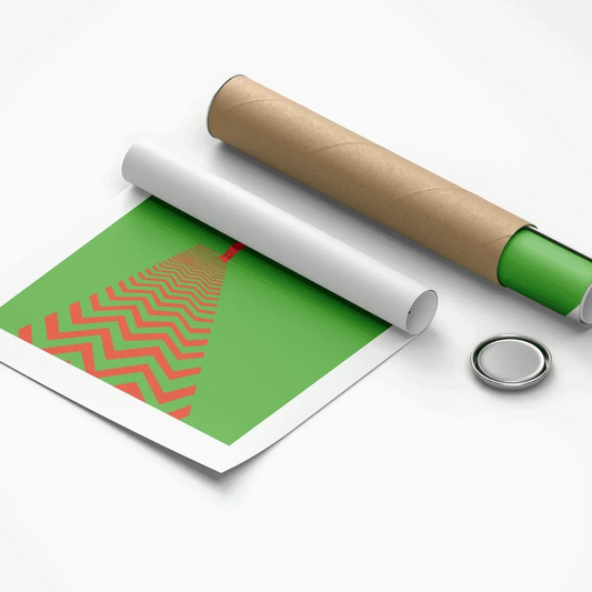 Roll of green paper with red pattern and cardboard tube on a white background