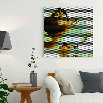 Living room with a modern couch, side table, and decorative wall art.