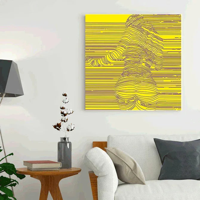 Abstract yellow and brown artwork on a white wall above a sofa.