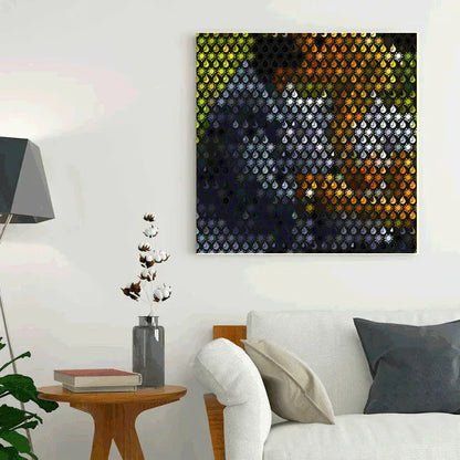 Abstract art piece on a wall above a sofa in a living room.