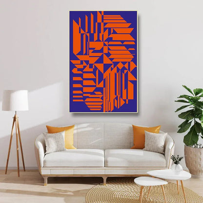 Living room with a geometric abstract painting, white sofa, and decorative elements.