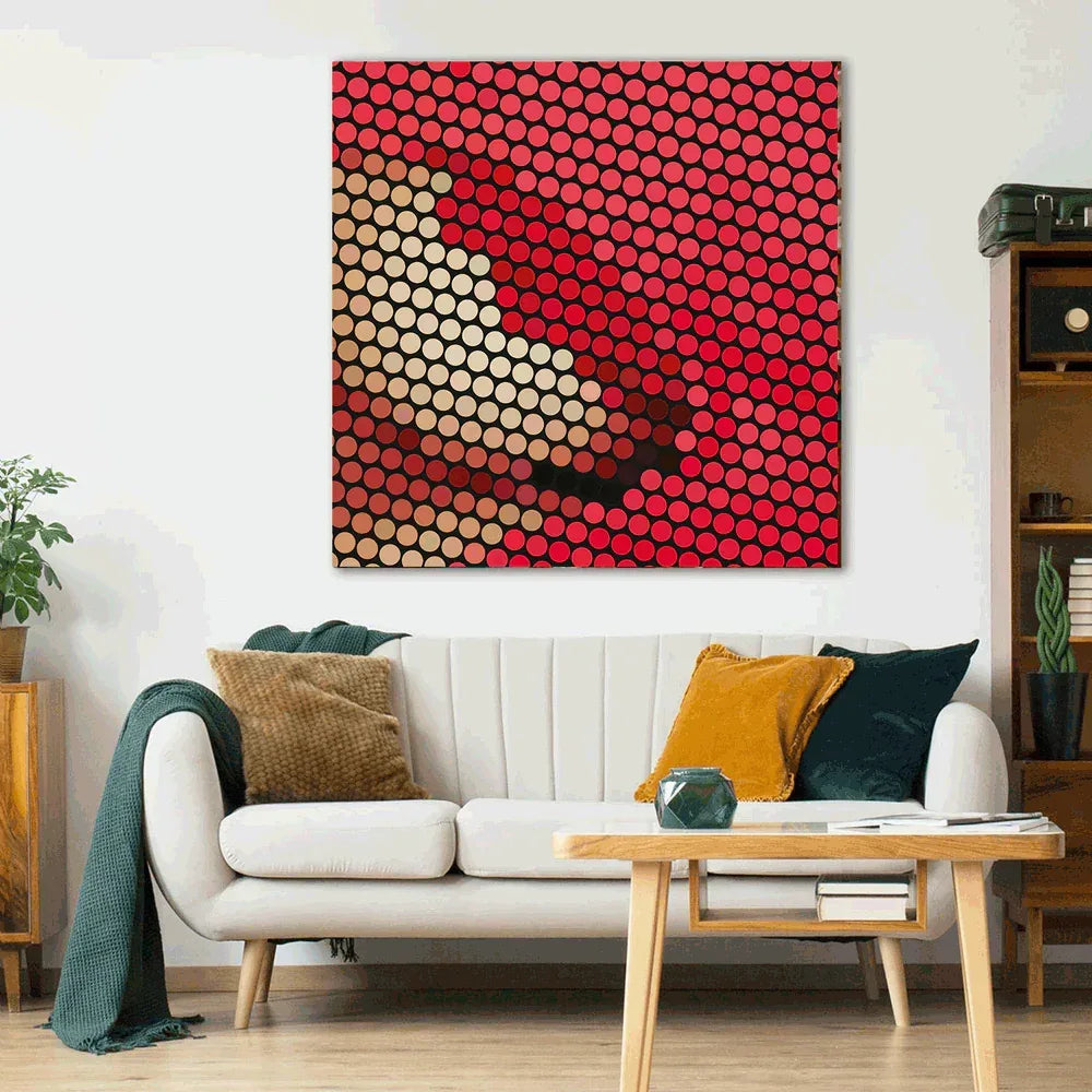 Abstract art piece with red and beige circles on a white wall above a sofa.