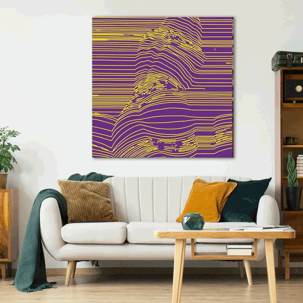 Living room with a white sofa, coffee table, and a large abstract painting on the wall.