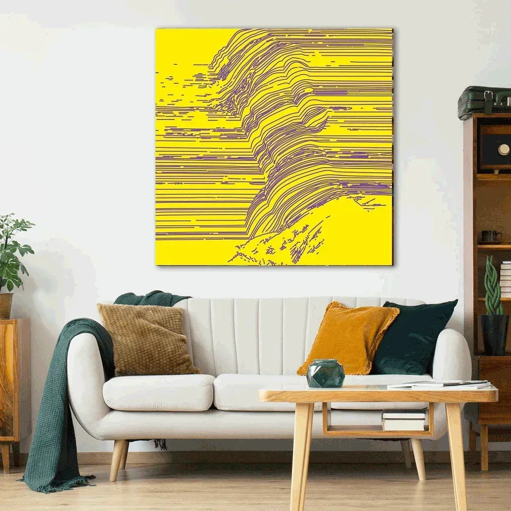 Living room with a white sofa, colorful pillows, and a large abstract painting on the wall.