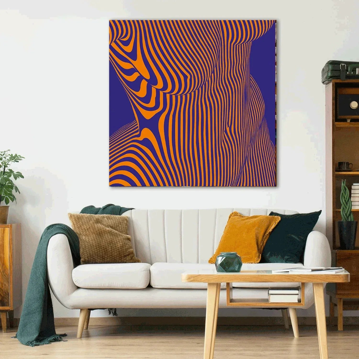 Living room with a white sofa, coffee table, and abstract art on the wall.