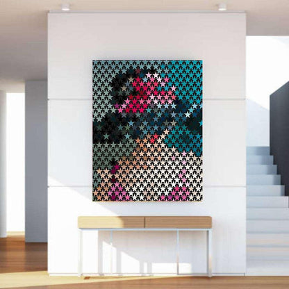 Colorful geometric abstract art piece on a white wall in a modern interior setting.