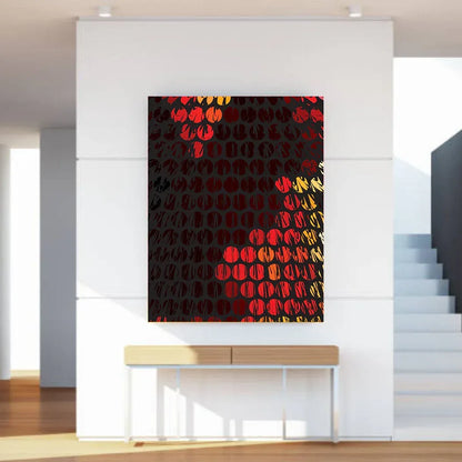 Abstract art piece with red and yellow patterns on a black background, displayed in a modern interior setting.
