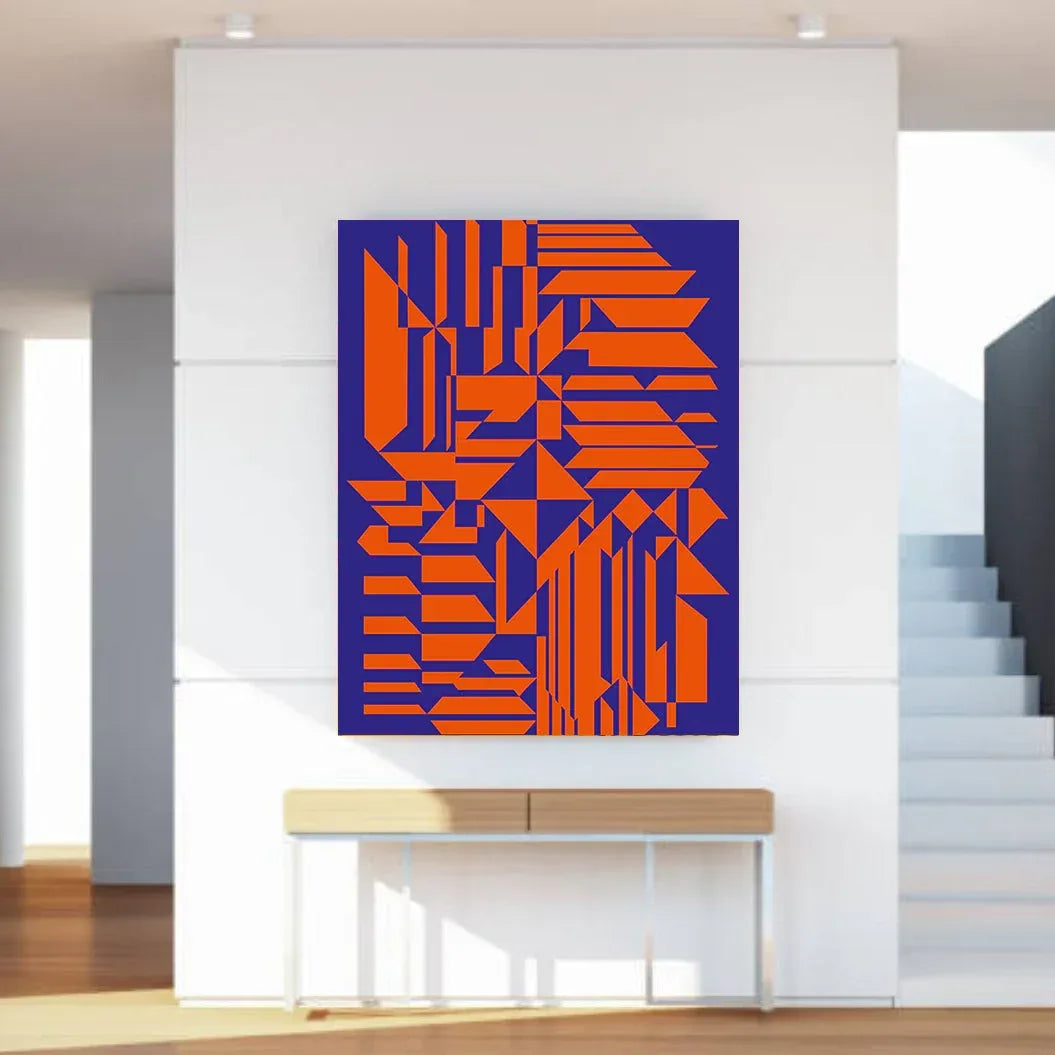Geometric abstract art in orange and blue on a white wall above a wooden console table.