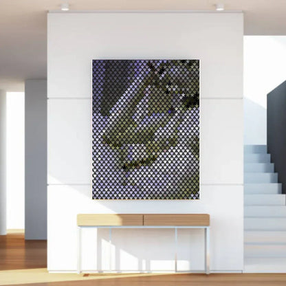 Abstract wall art piece on a white wall in a modern interior setting.