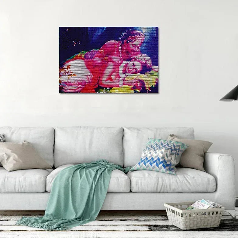 Colorful abstract painting on a white wall above a gray sofa with decorative pillows.