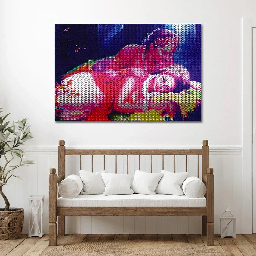 Colorful abstract painting on a wall above a wooden bench with white cushions.