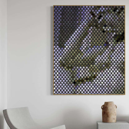 Abstract geometric art piece on a white wall with a chair and vase in the foreground.