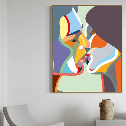 Abstract colorful painting on a wall with a chair and vase in the foreground.