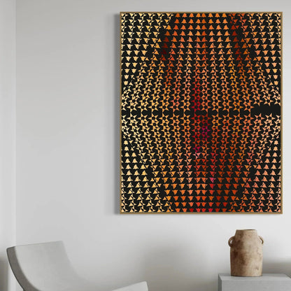 Abstract art piece with geometric pattern on a white wall, with a chair and vase in the foreground.