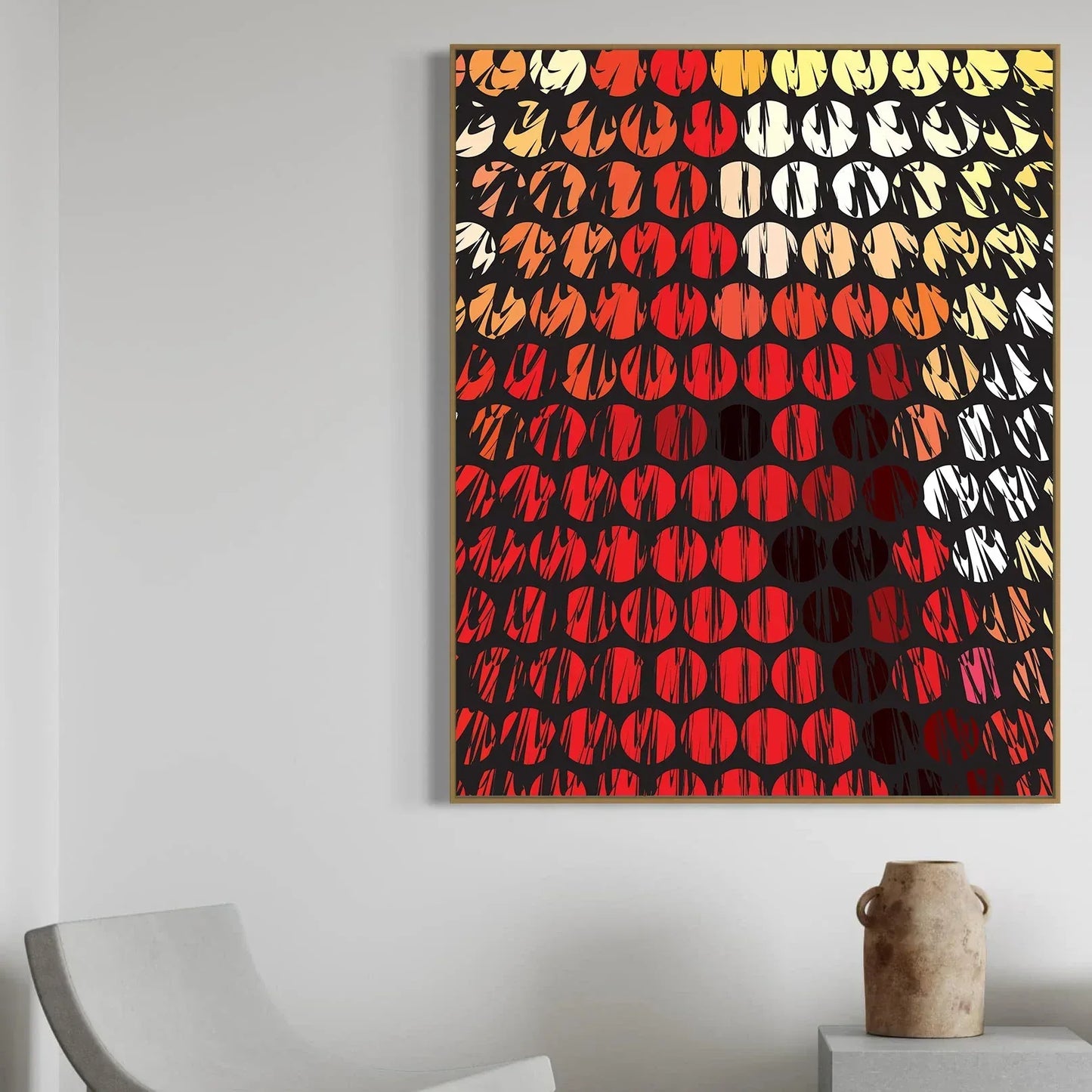 Abstract art piece with geometric pattern on a white wall above a chair and vase.