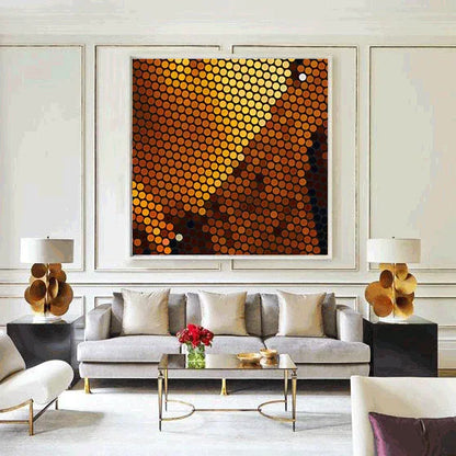 Modern living room with a gray sofa, abstract art, and decorative items.