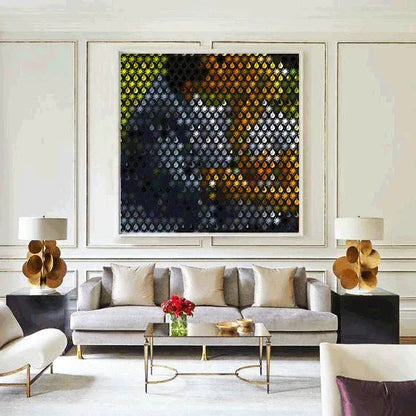 Modern living room with a gray sofa, abstract art, and decorative lamps.