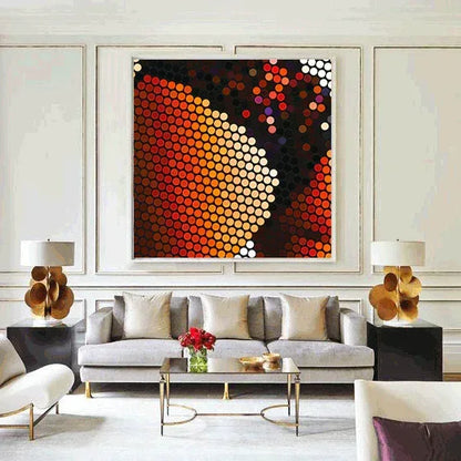 Modern living room with a gray sofa, coffee table, and abstract artwork on the wall.