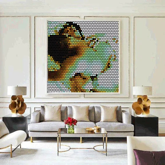 Modern living room with a large abstract painting on the wall, gray sofa, and decorative items.