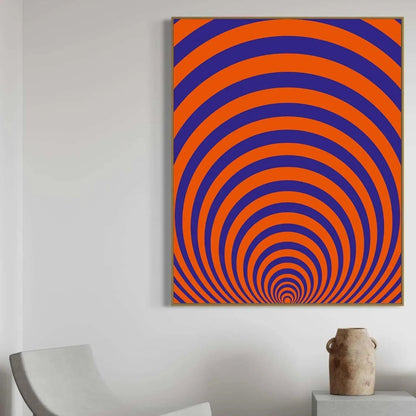 Abstract art with orange and blue concentric circles on a white wall.