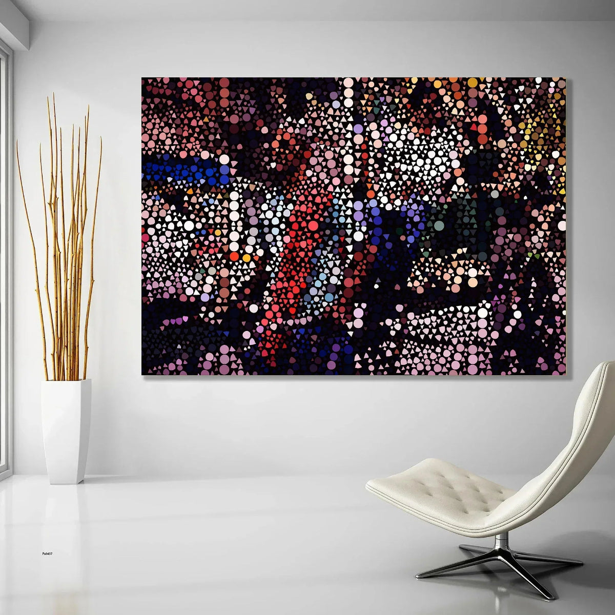 Abstract artwork with colorful dots on a wall above a modern chair.