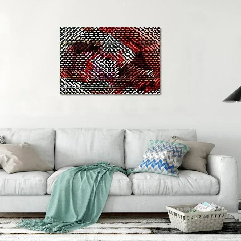 Abstract art piece on a wall above a white sofa with decorative pillows.