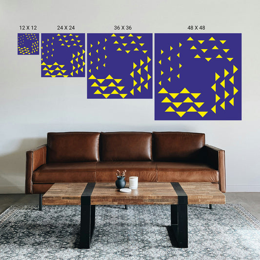 Living room with a brown leather sofa, wooden coffee table, and wall art with geometric patterns.