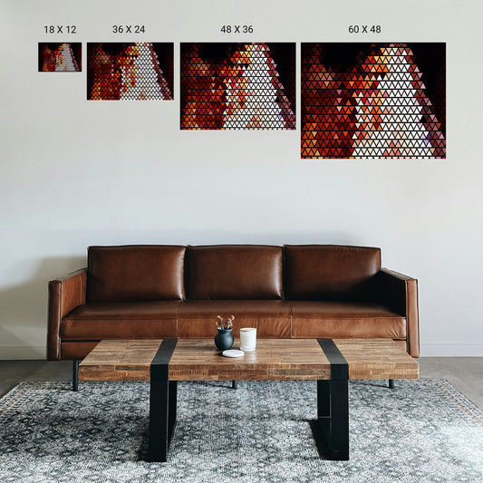 Small consultation room with a single centered symmetry print above a low sofa.