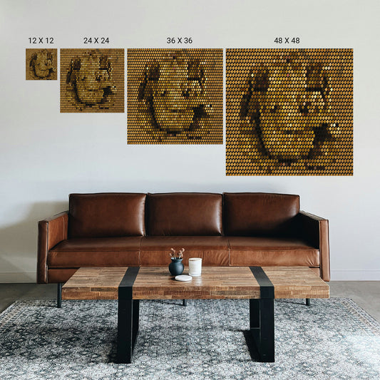 Brown leather sofa in a living room with wall art displaying different sizes.