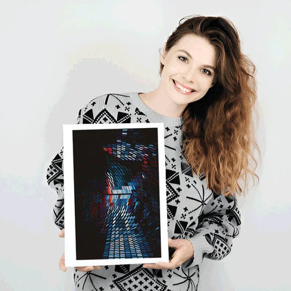 Woman holding a framed abstract artwork against a white background