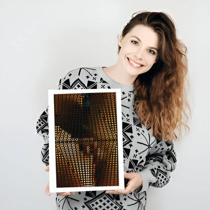Woman holding a framed artwork with abstract design on a plain background