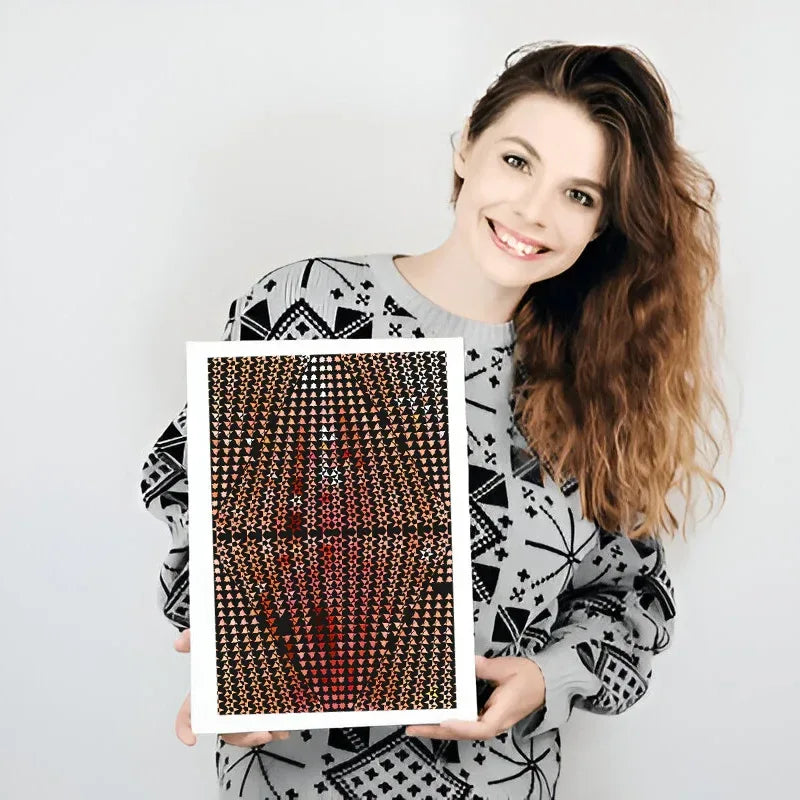 Woman holding a framed art print against a white background