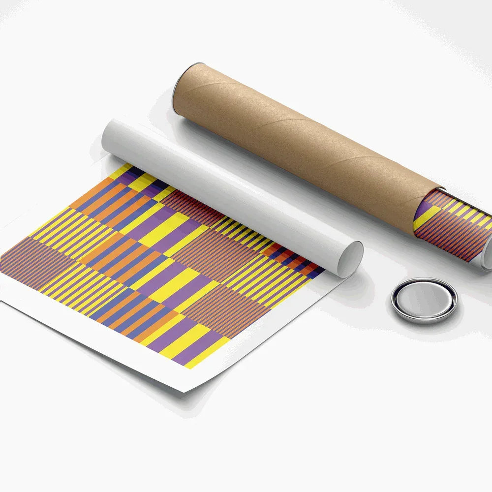 Roll of paper with geometric pattern next to a cardboard tube on a white background