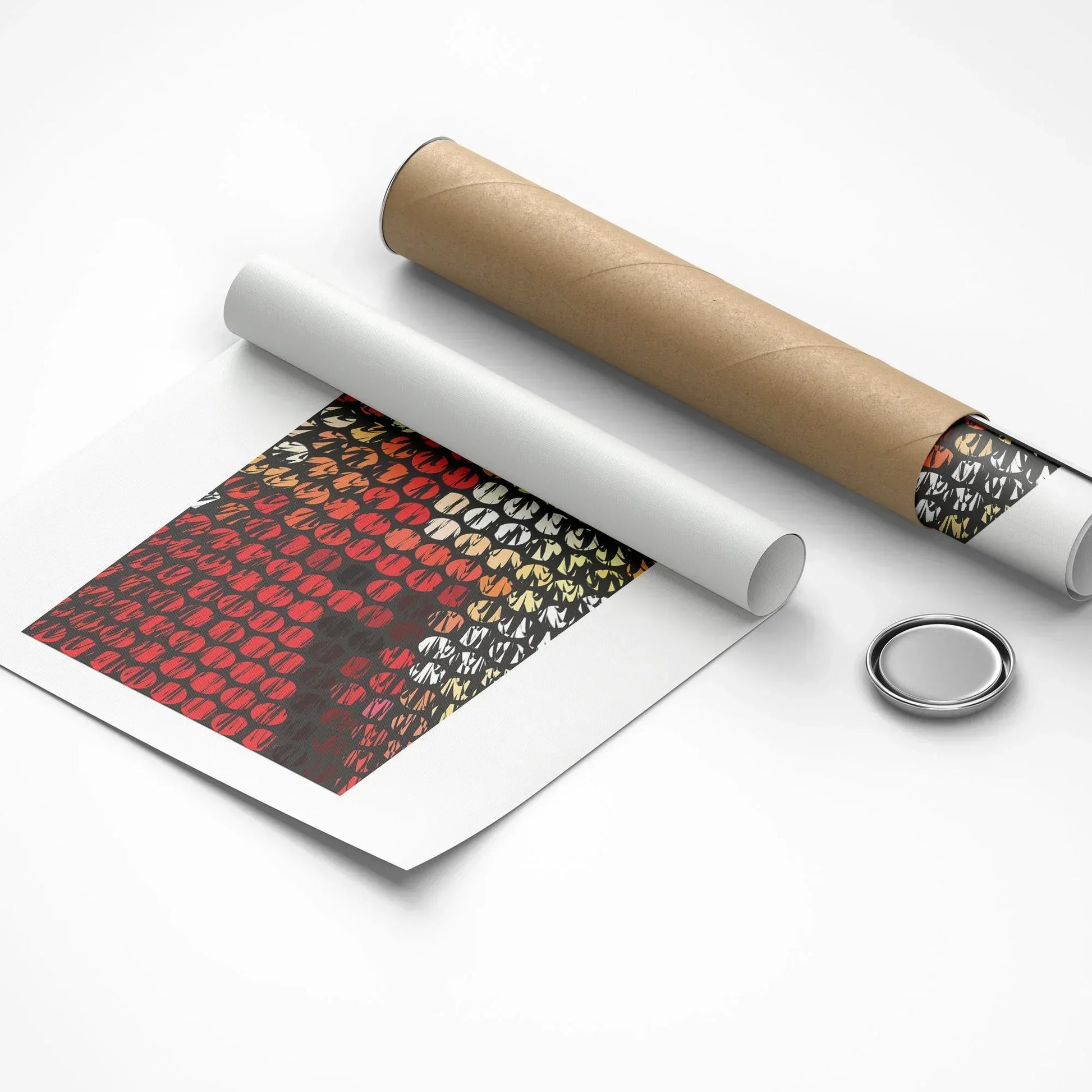 Roll of patterned paper with a roll of brown paper and a metal button on a white background