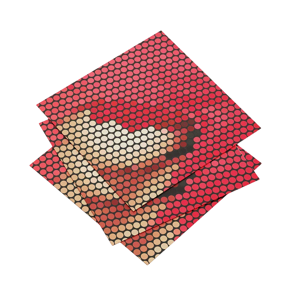 Three red and beige patterned paper sheets on a white background