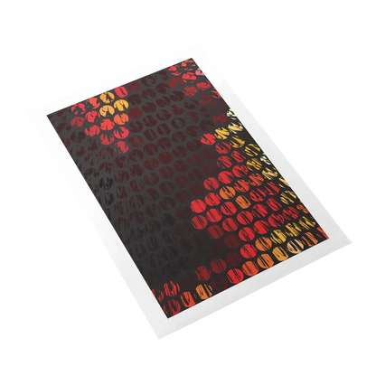 Patterned paper with red and yellow shapes on a black background