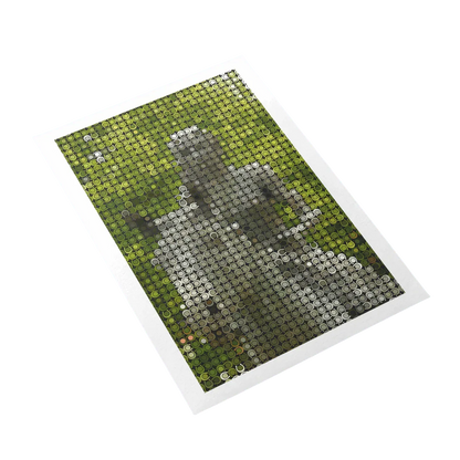 Cross-stitched design of a dog on a green fabric background