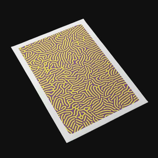 Therapy space with a trio of dot‑art prints arranged in a column.